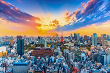 Tokyo's skyline at sunset, with Tokyo Tower marking the heart of Japan's bustling capital. Photo by Canva