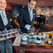 Two butlers serve afternoon tea in the Yacht Club lounge on the MSC Meraviglia