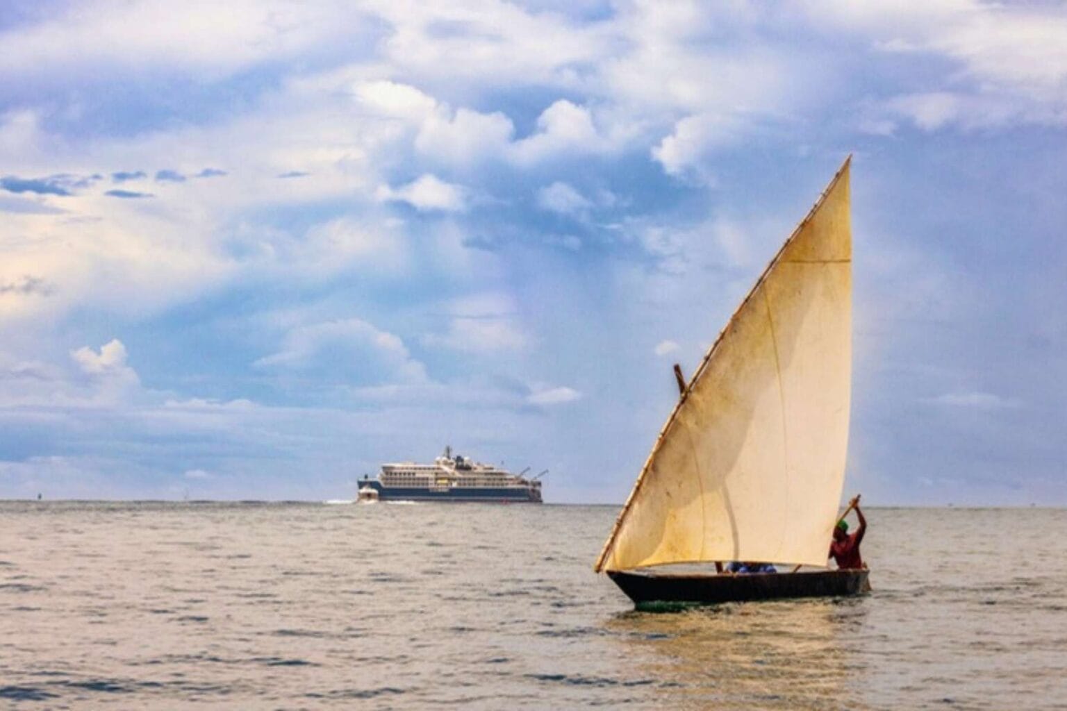 A traditional dhow sails past the Diana off Pemba Island in the Zanzibar Archipelago. Photo courtesy of Swan Hellenic