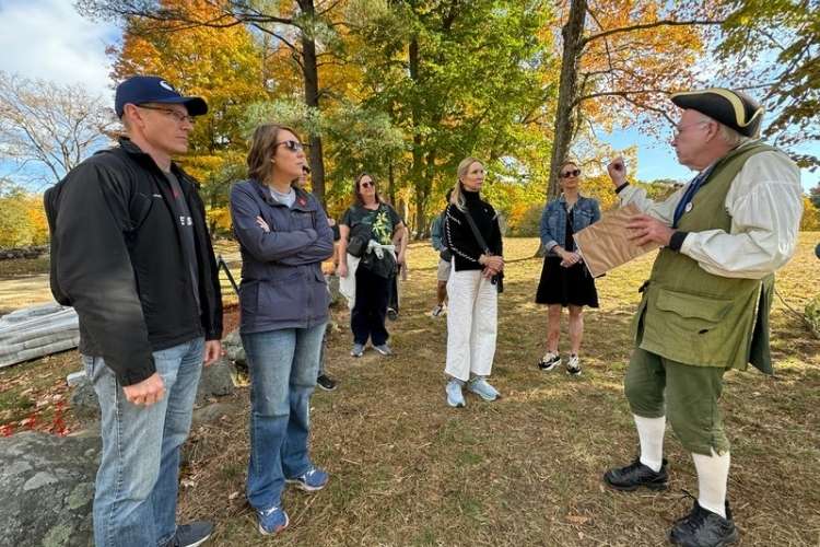 A guide giving a talk during a Liberty Ride Trolley presentation