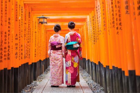 Fushimi Inari's iconic orange gates create a spiritual pathway through the forest to Japan's most sacred peak. Photo by Canva