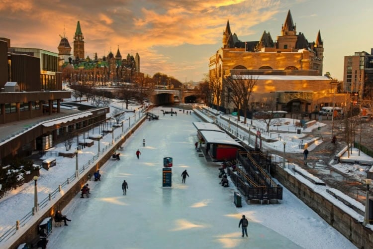 Rideau Canal with Parliament Hill. Photo by onurkurtic from Getty Images via Canva