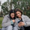 Two women looking at a phont. Photo by Yunus TuğYunus Tuğ, Unsplash