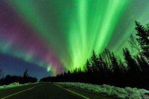 Aurora borealis in Fairbanks, Alaska. Photo by Youli Zhao from Getty Images via Canva