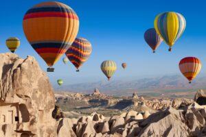 Cappadocia's surreal landscape is bets seen by hot air balloon. Image by Ig0rZh from Getty Images Pro via Canva