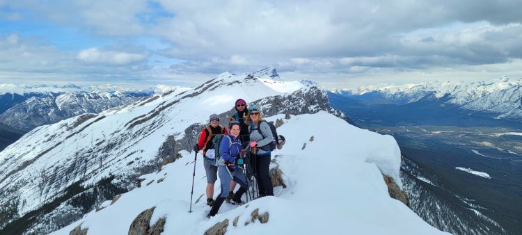 Standing atop the peak of Ha Ling in May, where winter conditions are still very much in effect despite it being a lovely spring day.