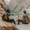 Desert trekking with friends opens new horizons beyond the familiar. Photo by NEOM, Unsplash