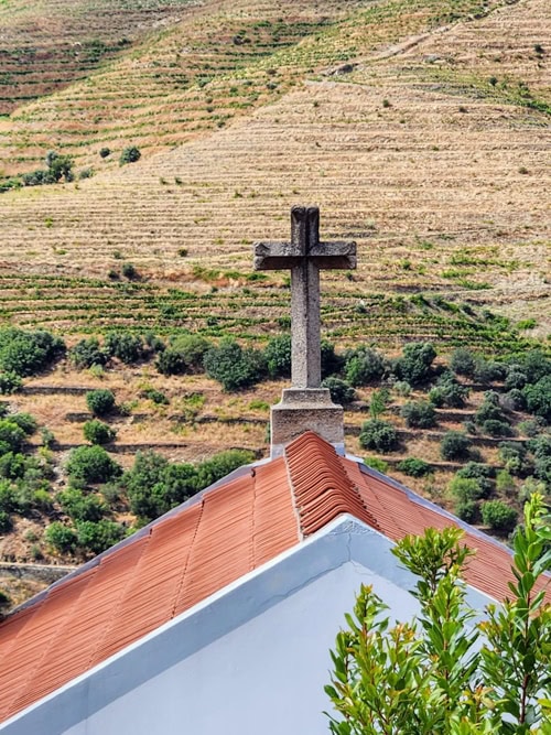 A terraced vineyard of the Douro Valley reaches for the heavens on a mountainside.