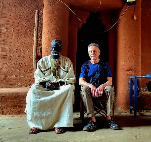 Author with the blind King of Bambara who, as was common among rulers in past times, holds court to arbitrate disputes among his subject.