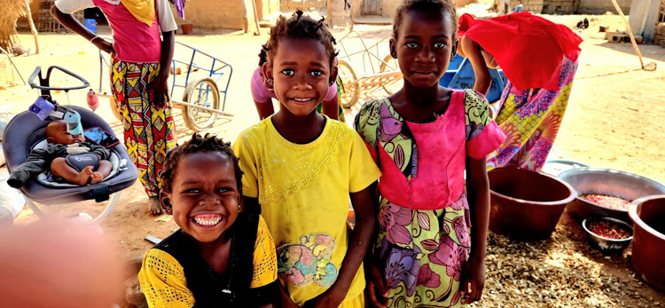In charming Djoulafoundo hamlet, excited, screaming children pleaded to be photographed