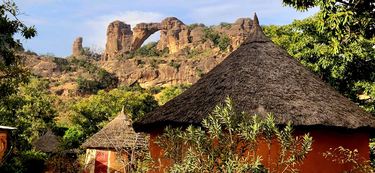 The Arch of Kadjan is a dramatic rock formation looming above the village of Siby in central Mali.