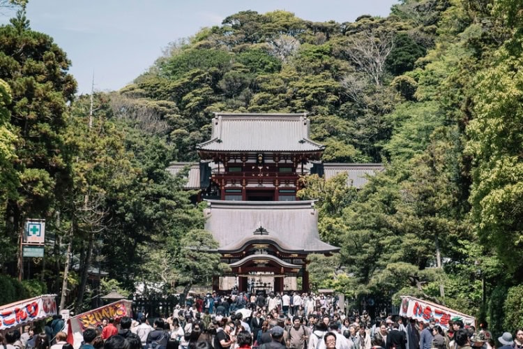People outside temple in Kamakura, Japan