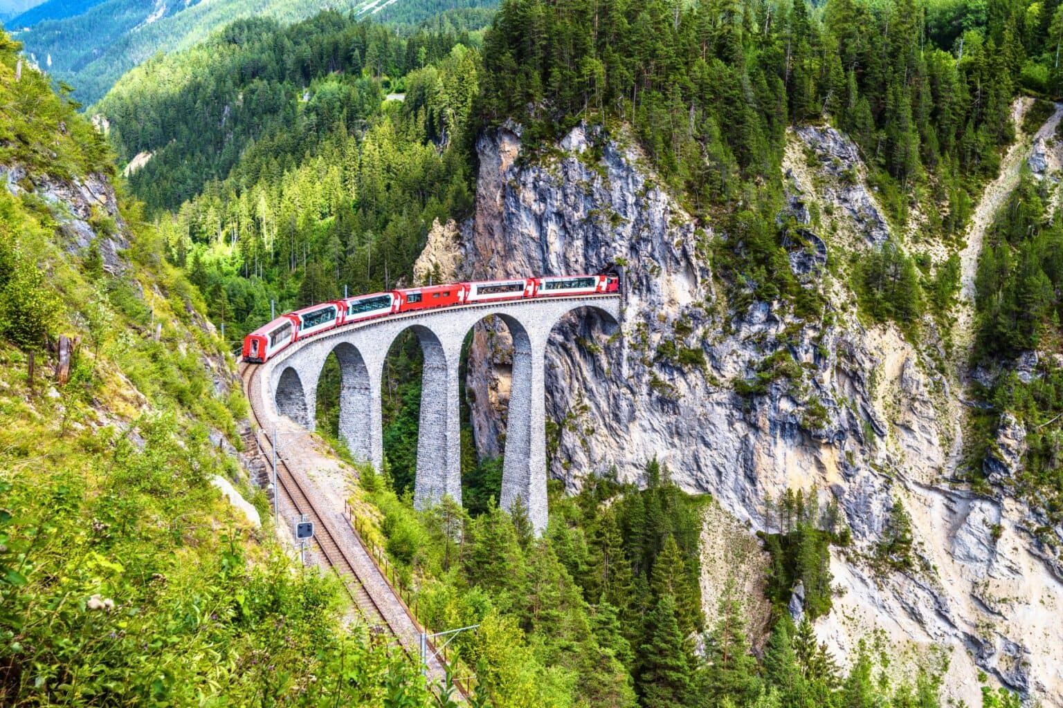 The Glacier Express: A Swiss journey through snow-capped peaks, one of Europe&rsquo;s most iconic experiences. Photo by scaliger via Canva