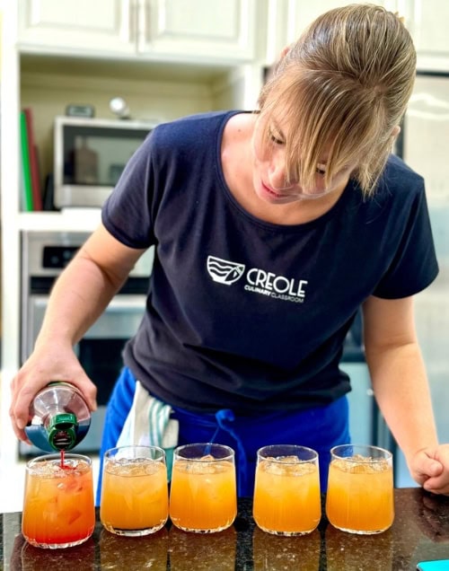 Chef/owner of the Creole Culinary Classroom Anna Toth preparing rum punch for her students