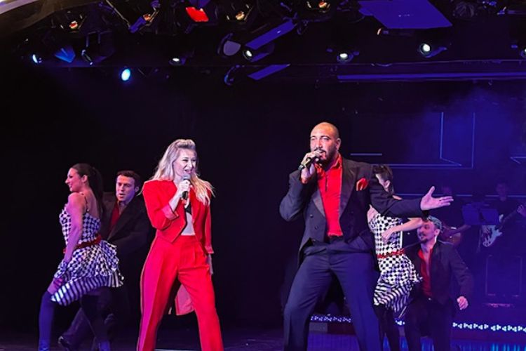 Lauren Heavner, the “lady in red,” sings, dances