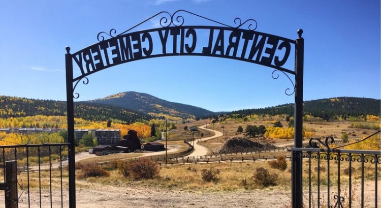 Image of an old cemetery in Central City with gravestones dating back over a century, many of which share emotional stories.