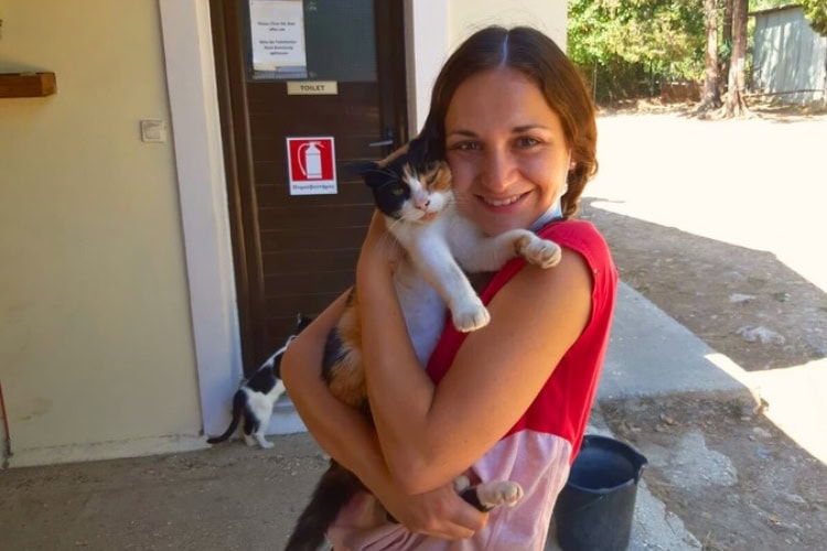 Jess with a cat at Corfu Donkey Rescue Centre