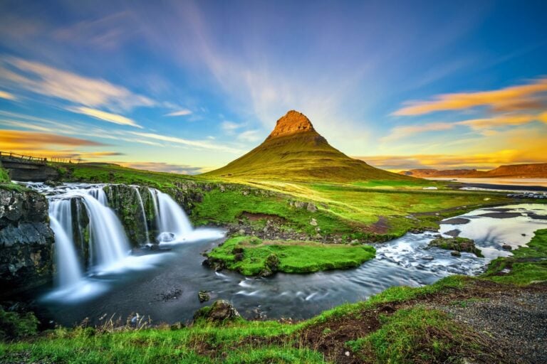 Where dreams begin: Iceland's Kirkjufell Mountain and waterfall at sunset. Photo by Nick Fox via Canva