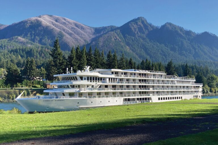 The American Harmony with mountain backdrop. Photo courtesy of American Cruise Lines