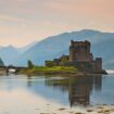Eilean Donan Castle on Loch Duich—gateway to Scotland's Great Glen, where centuries-old castles and pristine lochs define the Highland cruise experience. Photo by Juergen Schonnop via Canva
