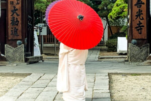 Bride in Nagano's temple complex epitomizes the inherent elegance and appreciation for color in Japanese culture. Photo by Christine Loomis