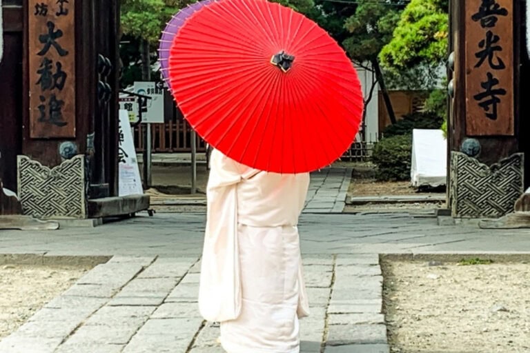 Bride in Nagano's temple complex epitomizes the inherent elegance and appreciation for color in Japanese culture. Photo by Christine Loomis