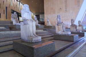 Ancient pharaohs line the main staircase at the Grand Egyptian Museum, offering visitors a dramatic first glimpse of what's to come. Photo by Keri G.