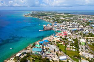 Grand Cayman's stunning coastline extends far beyond George Town's busy harbor—and the best beaches are waiting just down the road. Photo by Blue Sky from Getty Images via Canva