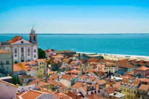 Lisbon’s gentle rhythm: where city life meets the sea and time slows to a human pace. Photo by minemero from Getty Images Signature via Canva