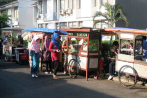 Street food vendors showcasing their everyday warmth and community connection, reminiscent of a tofu seller who maintains history with her cooking practices.