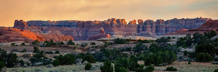 The last of the sunset light hits The Needles at Canyonlands National Park. Photo by Teri K. Miller