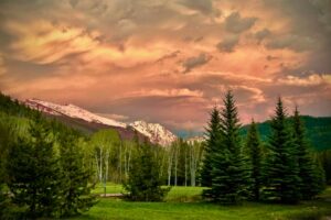 Where moose graze at sunrise and mountain peaks pierce the sky. Arapaho Valley Ranch offers raw Colorado wilderness just 2.5 hours from Denver. Photo by Teri K. Miller