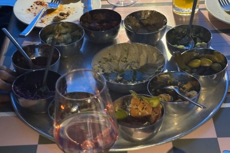 Partially eaten mezze platter at Laser Wolf