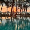 Sunset over the pool and beach at InterContinental Phuket Resort, a tranquil scene on Thailand’s largest island. Photo by Isabella Miller