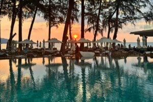 Sunset over the pool and beach at InterContinental Phuket Resort, a tranquil scene on Thailand’s largest island. Photo by Isabella Miller