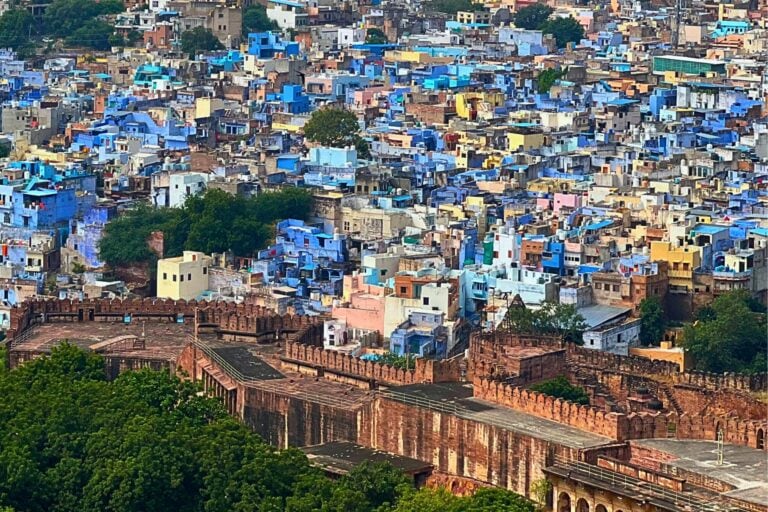 An aerial view of Jodhpur, India—its iconic blue houses spreading across the old city like a watercolor. Photo by Babitha Balakrishnan