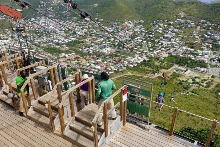 Riding the 2800-foot Flying Dutchman zip line down the mountain