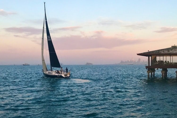 Sailboat in Sausalito harbor at sunset