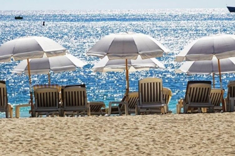 A beautiful view of one of St. Martin's 37 beaches, showcasing its inviting sandy shoreline and clear blue waters