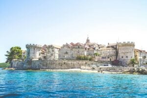 View at old city of Korčula and fortress in Croatia. Photo by Hilthart Pedersen, Unsplash