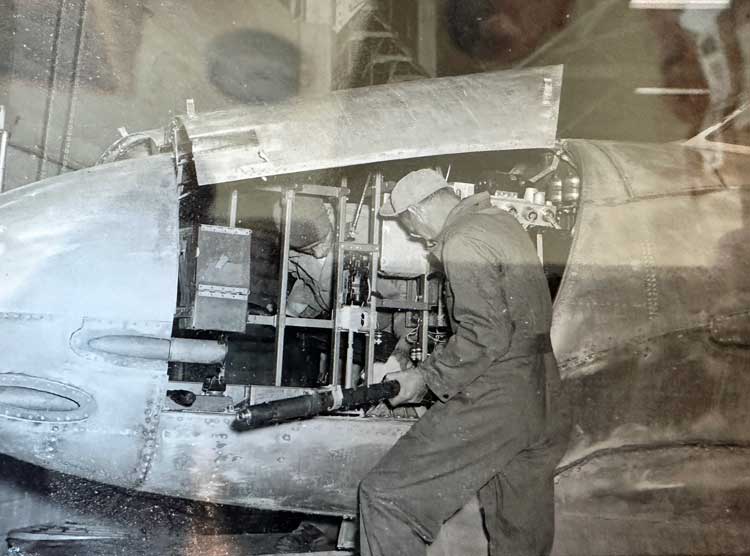 My grandpa working on a plane during WWII. Photo courtesy Janna Graber