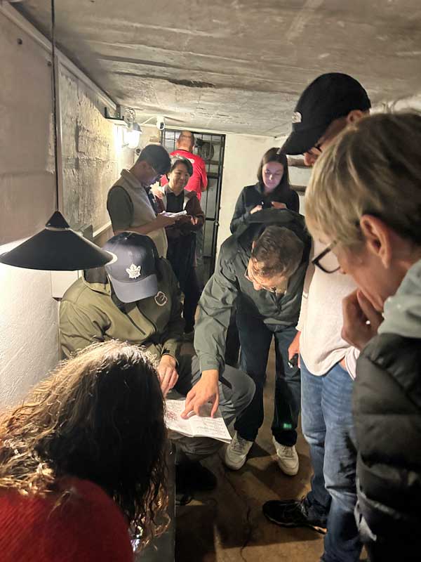 Our fun group working together on an Escape Room game in a historic bunker. Photo by Janna Graber