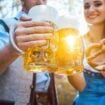 Couple Toasting Beer Glasses. Photo by EyeEm Mobile GmbH, iStock