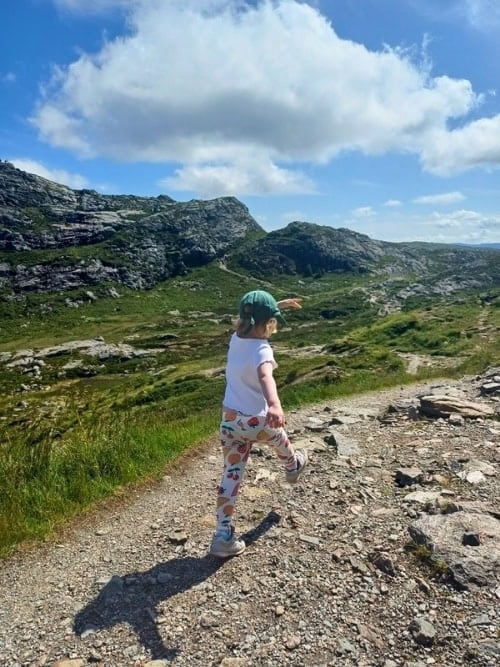 My daughter high on the mountain top of Mount Ulriken. Photo by Hannah