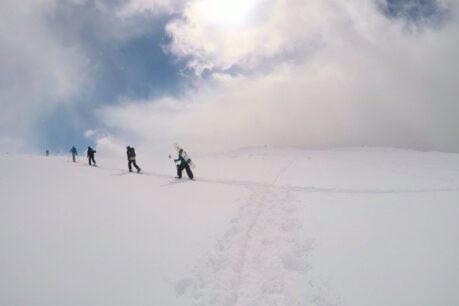Backcountry tourers heading up the volcano Asahidake in Japan. Photo by Liv Headley