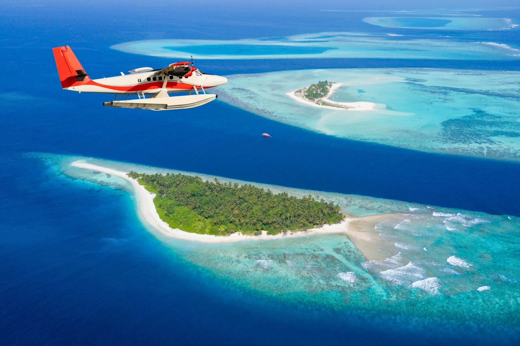 Sea plane soaring above the Maldives. Photo by Jag_cz via iStock