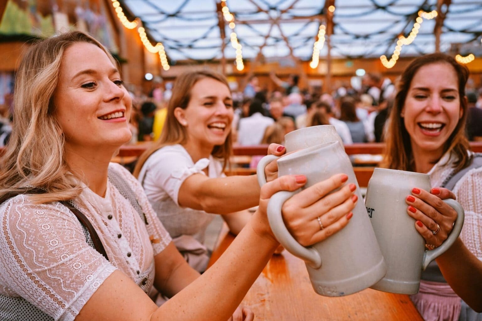 A group of women sitting around a wooden table. Photo by Roberta SantAnna, Unsplash