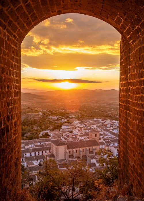 V&eacute;lez-Blanco through an arch at El Castillo at sunrise, V&eacute;lez-Blanco, Spain