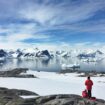 Two People Looking at Antarctic Landscape