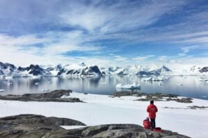 Two People Looking at Antarctic Landscape